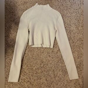 Divided white mock neck cropped long sleeve sweater